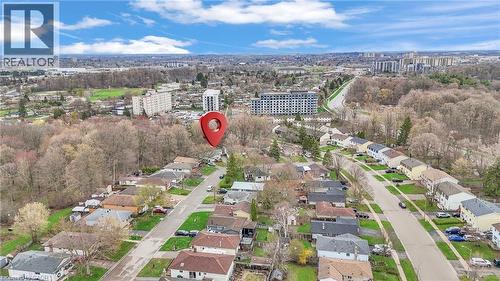 Aerial view of a residential neighborhood with detached homes, mature trees, and urban infrastructure - 22 Blackhorne Crescent, Kitchener, ON - Outdoor With View