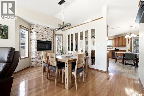 3524 Canterbury Place E, Regina, SK - Indoor Photo Showing Dining Room With Fireplace