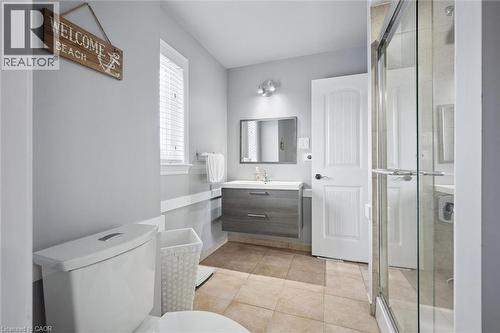 Bathroom featuring a glass-enclosed shower, a floating vanity with a vessel sink, a mirrored medicine cabinet, a window with blinds, and neutral-toned floor tiling - 5449 Rochelle Way, Mississauga, ON - Indoor Photo Showing Bathroom