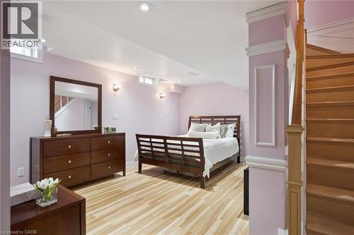 Spacious room featuring light wood-finish flooring, recessed lighting, and twin egress windows - 5449 Rochelle Way, Mississauga, ON - Indoor Photo Showing Bedroom