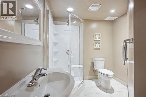 Bathroom featuring a glass-enclosed shower, white toilet, pedestal sink with chrome faucet, and recessed lighting - 5449 Rochelle Way, Mississauga, ON - Indoor Photo Showing Bathroom