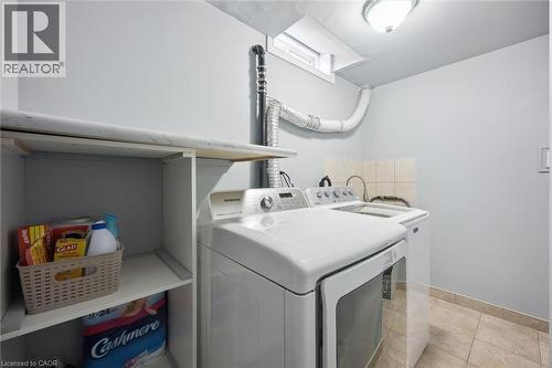 Dedicated laundry area featuring tile flooring and light gray wall paint - 5449 Rochelle Way, Mississauga, ON - Indoor Photo Showing Laundry Room