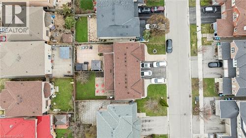 Residential property featuring a spacious paved driveway, an expansive backyard patio, and a verdant lawn area - 5449 Rochelle Way, Mississauga, ON - Other