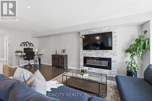 807 Element Private, Ottawa, ON - Indoor Photo Showing Living Room With Fireplace