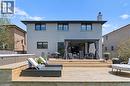 Rear view of property featuring a wooden deck, stucco siding, a chimney, and an outdoor living space - 17 Clearview Drive, Hamilton, ON  - Outdoor 