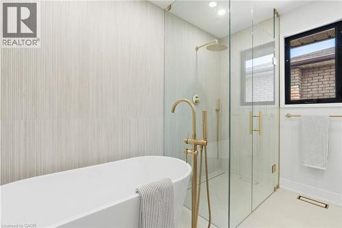 Full bath featuring a soaking tub, a shower stall, and recessed lighting - 17 Clearview Drive, Hamilton, ON - Indoor Photo Showing Bathroom