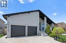 Contemporary exterior with a prominent A-frame roofline and light stucco finish - 17 Clearview Drive, Hamilton, ON  - Outdoor 