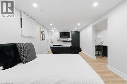 Bedroom featuring built in study area, light wood finished floors, and recessed lighting - 17 Clearview Drive, Hamilton, ON - Indoor