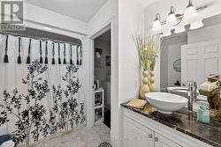 Main Floor Bathroom/ Laundry Closet - 