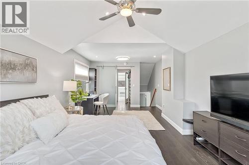 Vaulted ceilings with a ceiling fan, dark wood-finish flooring, recessed lighting, a built-in desk area, and a barn door entry - 2123 Deyncourt Drive, Burlington, ON - Indoor Photo Showing Other Room