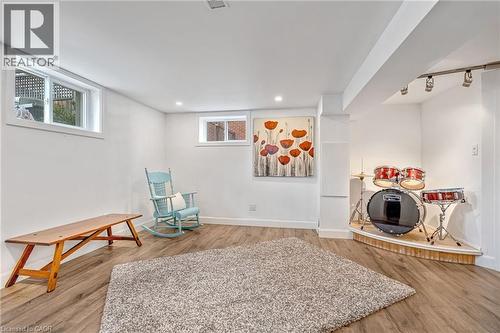 Versatile lower level featuring wood-finish flooring, recessed lighting, and white walls - 2123 Deyncourt Drive, Burlington, ON - Indoor