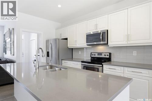 243 Newton Link, Saskatoon, SK - Indoor Photo Showing Kitchen With Stainless Steel Kitchen With Double Sink With Upgraded Kitchen