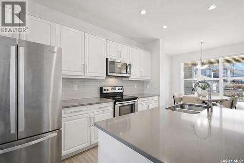 243 Newton Link, Saskatoon, SK - Indoor Photo Showing Kitchen With Stainless Steel Kitchen With Double Sink With Upgraded Kitchen