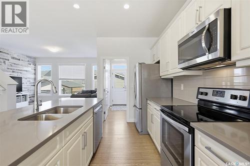 243 Newton Link, Saskatoon, SK - Indoor Photo Showing Kitchen With Stainless Steel Kitchen With Double Sink With Upgraded Kitchen