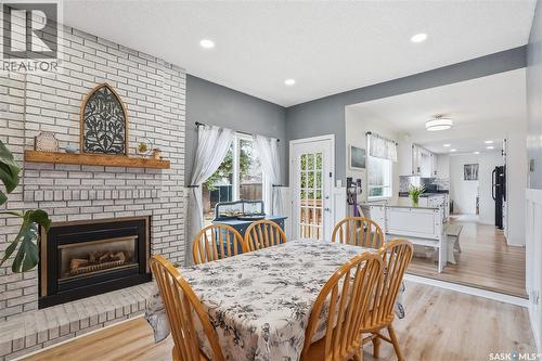 542 Coldspring Way, Saskatoon, SK - Indoor Photo Showing Dining Room With Fireplace