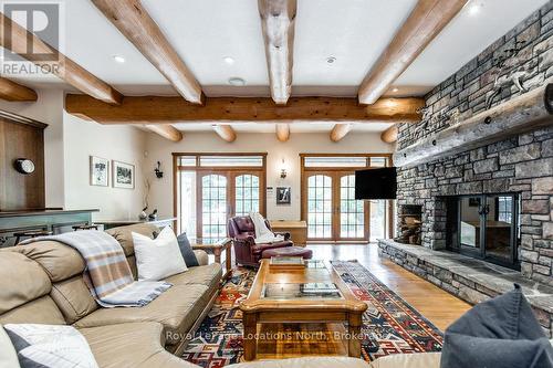100 Melissa Lane, Tiny, ON - Indoor Photo Showing Living Room With Fireplace