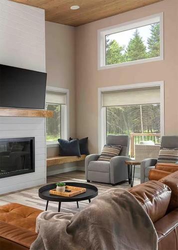56 3 Mooswa Drive E, Onanole, MB - Indoor Photo Showing Living Room With Fireplace