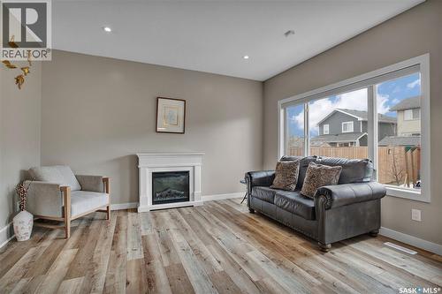 211 Stilling Union, Saskatoon, SK - Indoor Photo Showing Living Room With Fireplace