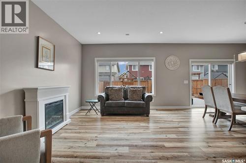 211 Stilling Union, Saskatoon, SK - Indoor Photo Showing Living Room With Fireplace