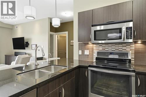 308 721 8Th Street E, Saskatoon, SK - Indoor Photo Showing Kitchen With Double Sink