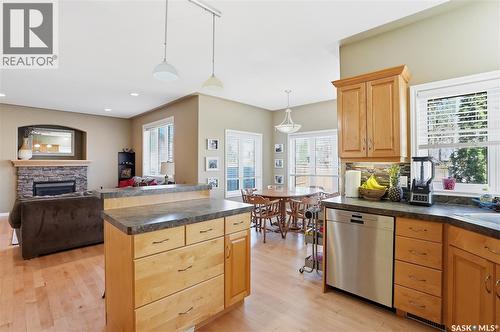 307 Van Impe Court, Saskatoon, SK - Indoor Photo Showing Kitchen With Fireplace