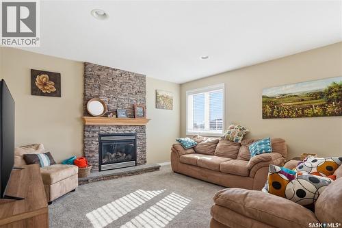 307 Van Impe Court, Saskatoon, SK - Indoor Photo Showing Living Room With Fireplace