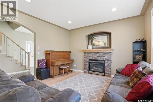 307 Van Impe Court, Saskatoon, SK - Indoor Photo Showing Living Room With Fireplace