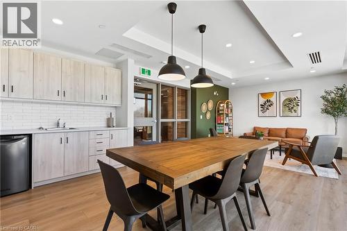 Dining room with a tray ceiling, recessed lighting, and light wood-style flooring - 3998 Victoria Avenue Unit# 105, Lincoln, ON - Indoor