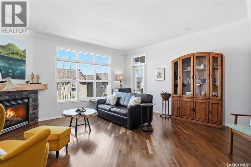 304 218 Heath Avenue, Saskatoon, SK - Indoor Photo Showing Living Room With Fireplace