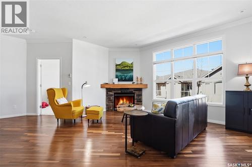 304 218 Heath Avenue, Saskatoon, SK - Indoor Photo Showing Living Room With Fireplace