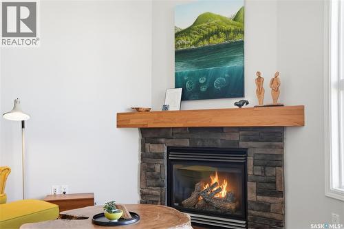 304 218 Heath Avenue, Saskatoon, SK - Indoor Photo Showing Living Room With Fireplace