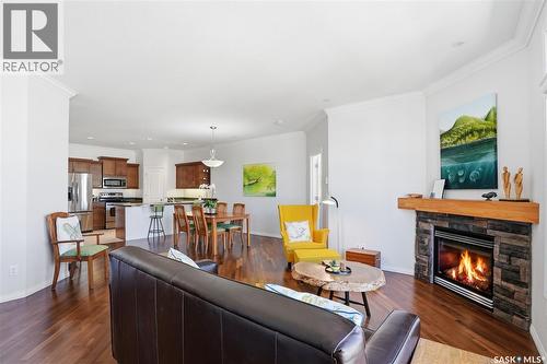 304 218 Heath Avenue, Saskatoon, SK - Indoor Photo Showing Living Room With Fireplace