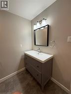 Bathroom featuring vanity and baseboards - 