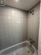 Full bath featuring shower / tub combo - 