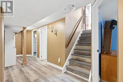 Stairs leading into basement rec room - 