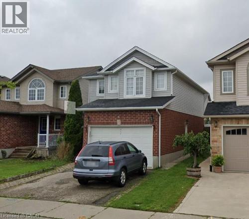 Two-story residence featuring a brick first level and light gray siding on the second level - 965 Copper Leaf Crescent, Kitchener, ON - Outdoor With Facade