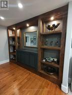 DINING ROOM BUILT IN PRE GLASS BARN DOORS - 