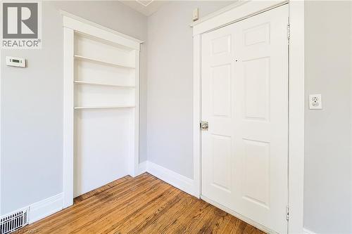 Built-in shelving unit providing storage and display space - 254 Emerald Street N Unit# Upper, Hamilton, ON - Indoor Photo Showing Other Room