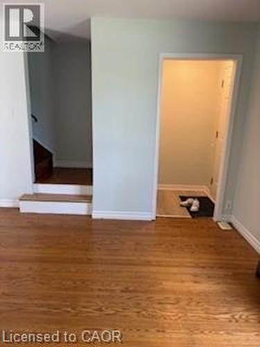Rich wood-finish flooring extending throughout the space - 648 Francis Road, Burlington, ON - Indoor Photo Showing Other Room
