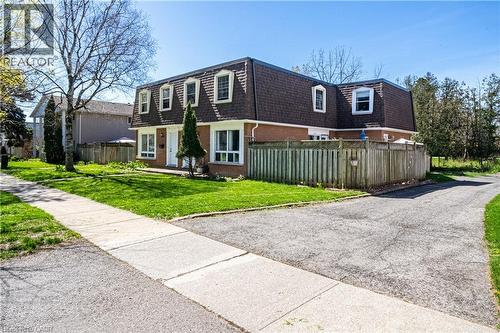Brick facade property with a dormer roofline and multiple windows - 648 Francis Road, Burlington, ON - Outdoor