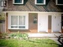 Brick facade with white trim and a brown shingle roof - 648 Francis Road, Burlington, ON  - Outdoor 