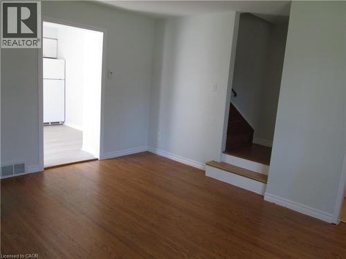Hardwood-style flooring throughout the main room - 648 Francis Road, Burlington, ON - Indoor Photo Showing Other Room