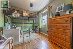 Room featuring wood-finish flooring and a window with natural light - 