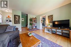 Hardwood flooring extending throughout the living space - 