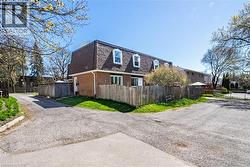 Brick exterior with a dark gambrel roof - 