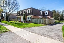 Brick facade property with a dormer roofline and multiple windows - 