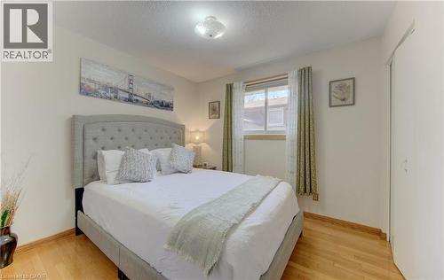 Bright interior with wood-finish flooring - 170 Martinglen Crescent, Kitchener, ON - Indoor Photo Showing Bedroom