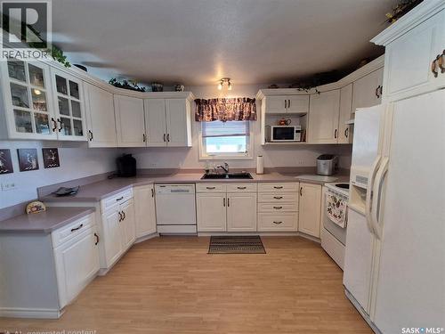 317 2Nd Street W, Ponteix, SK - Indoor Photo Showing Kitchen With Double Sink