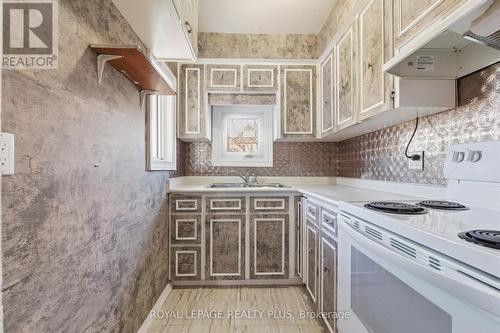 115 Kensington Avenue N, Hamilton, ON - Indoor Photo Showing Kitchen With Double Sink
