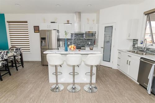 1 Warbler Way, Winkler, MB - Indoor Photo Showing Kitchen With Stainless Steel Kitchen With Double Sink With Upgraded Kitchen